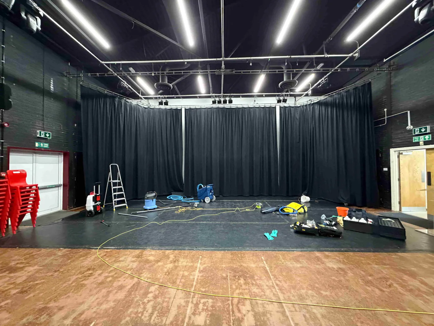 Stage curtains and equipment during curtain cleaning and fire retardant treatment