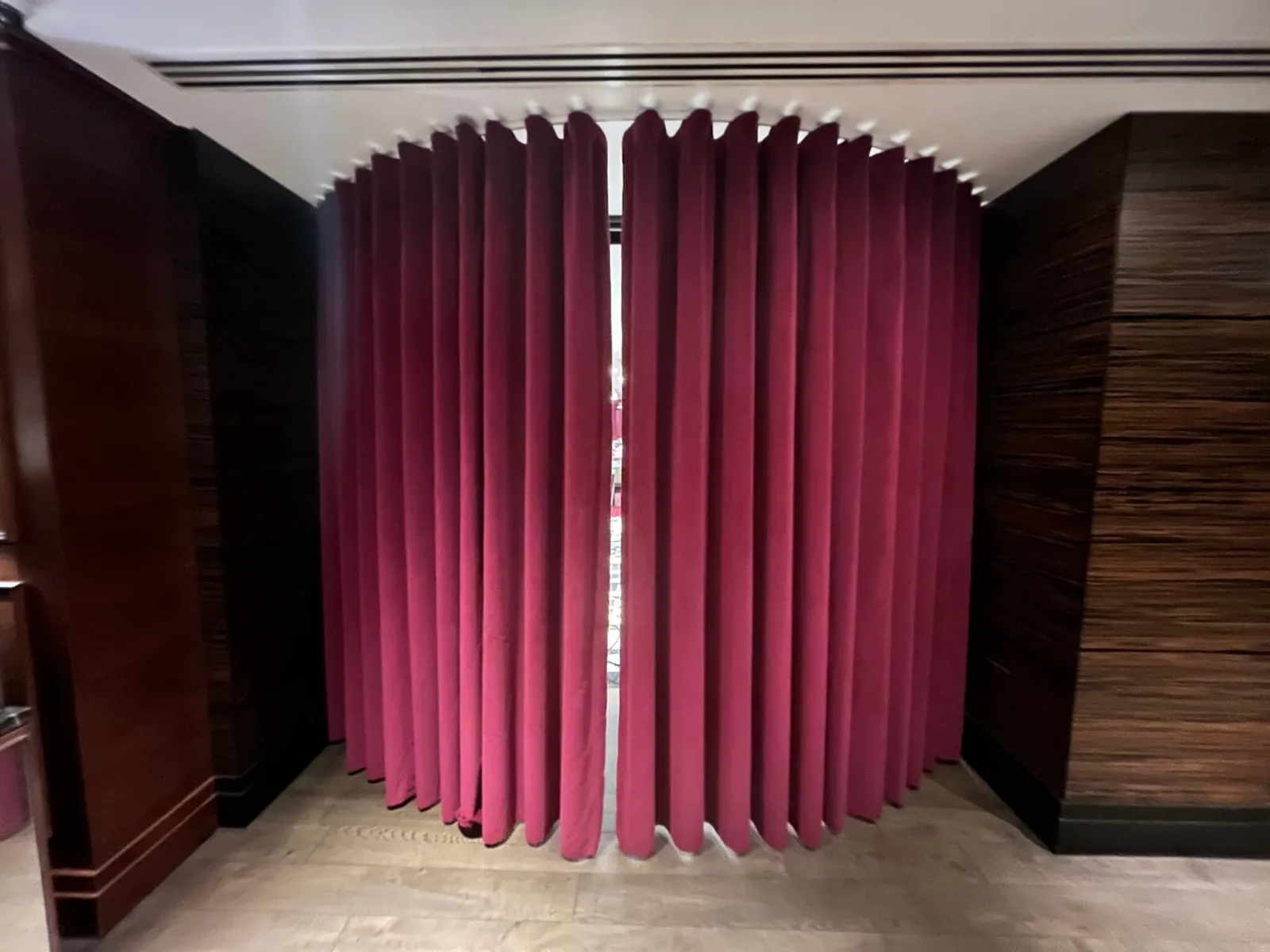 Deep pink curtains in paying-guest accommodation